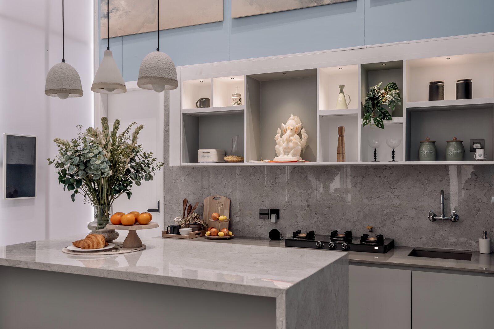 The kitchen island at the Experience Centre with tunable cove lighting