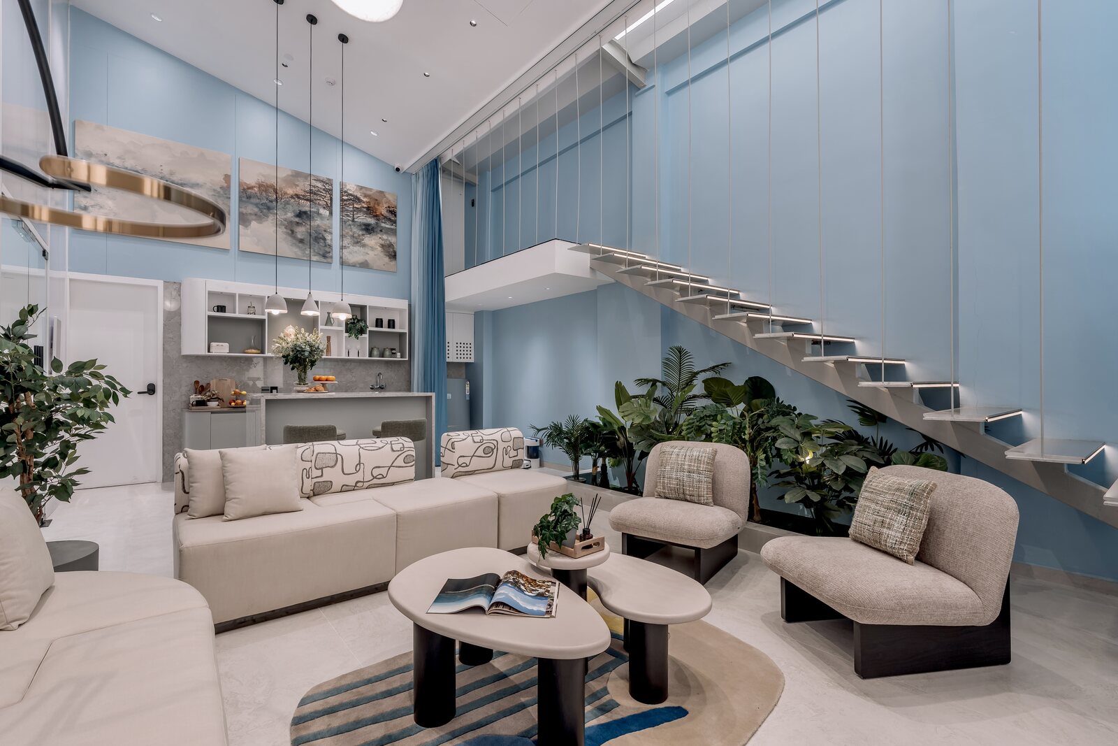 A double-height living room at the Meshronix Experience Centre, lit for the evening