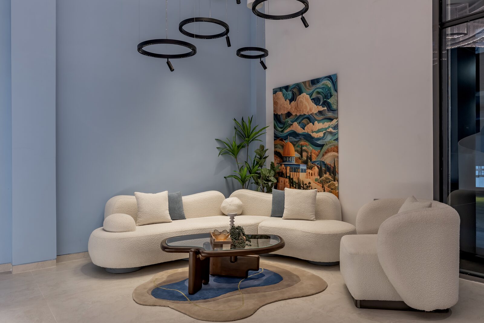 A lounge at the Experience Centre with sculptural lighting and art